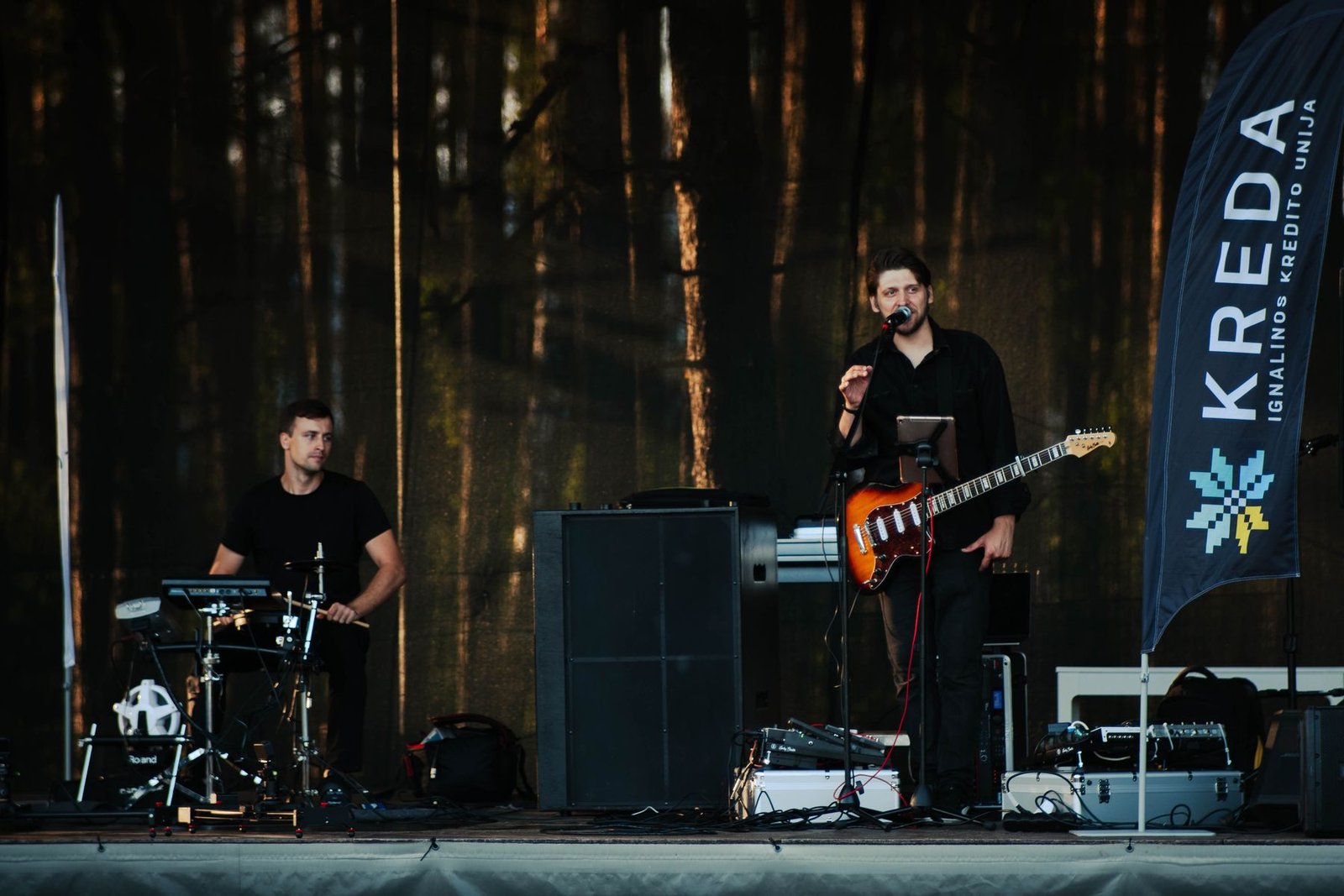 Justinas Stanislovaitis and the drummer on an open-air stage